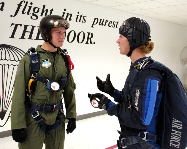 U.S. Air Force Academy Cadet 3rd Class David Barron is briefed by jumpmaster Cadet 1st Class Lindsey Robinson July 7 during Airmanship 490, Basic Parachuting, an airmanship program where cadets earn their basic jump wings after successfully completing five free-fall jumps. (U.S. Air Force photo/Mike Kaplan)