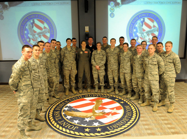 University of Tennessee Air Force Reserve Officer Training Corps cadets pose for a group photo during their visit to Joint Task Force Civil Support here March 20, 2014. More than 20 cadets received a mission brief and took a tour of the headquarters building as part of their spring 2014 Hampton Roads military base tour. JTF-CS anticipates, plans and prepares for chemical, biological, radiological, and nuclear defense support of civil authority (CBRN-DSCA) response operations. When directed, JTF-CS deploys to command and control DOD forces in support of civil authority response operations in order to save lives, prevent further injury and provide temporary critical support to enable community recovery. (Official DOD photo by U.S. Navy Petty Officer 1st Class Brian Dietrick)