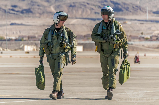 The crew of a US Navy EA-18G Growler return after a Red Flag training mission at Nellis AFB, Nevada.