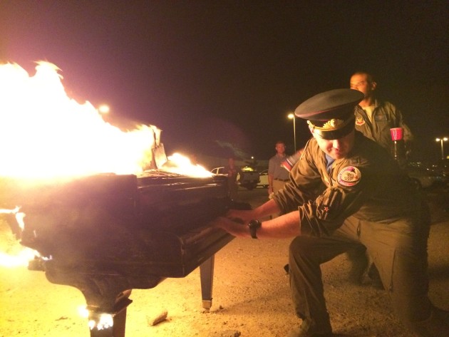 Members of the 65 AGRS burn a piano to mark the inactivation of the 65th Aggressor Squadron at Nellis AFB, Nevada.