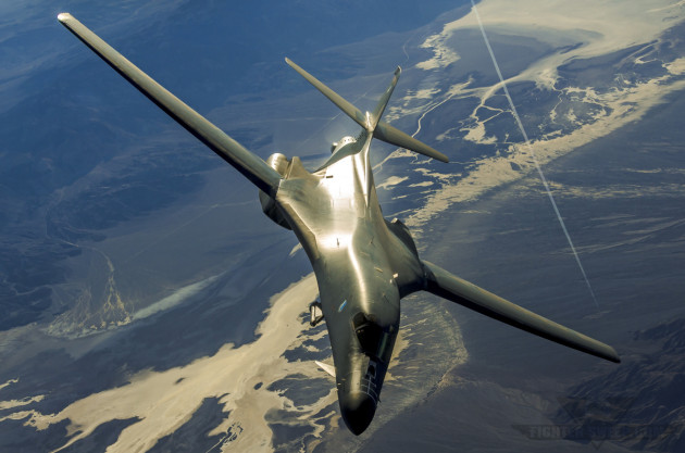 A Rockwell (Boeing) B-1B Lancer equipped with the AN/AAQ-33 Sniper pulls off the tanker while en route to engage insurgent positions.