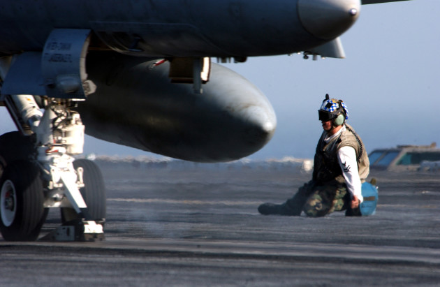A troubleshooter clears an F/A-18C Hornet assigned to the "Blue Diamonds" of Strike Fighter Squadron One Four Six (VFA-146) for launch from one of four steam-driven catapults on board the Nimitz-class aircraft carrier USS Carl Vinson (CVN 70). U.S. Navy photo by Photographer's Mate 2nd Class Inez Lawson (RELEASED)