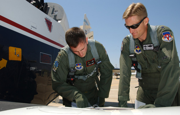 Student pilot 2nd Lt. Grant Webber and instructor pilot Lt. Col. Mike Jansen perform pre-flight checks on a T-6 Texan aircraft at Vance AFB, Okla. (U.S. Air Force photo/ Staff Sgt. Brian Hill)