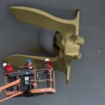 Photo of the Day: CO of USS Dwight D. Eisenhower (CVN 69) Painting Ships Anchor Gold
