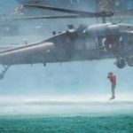 Picture of the Day: Air Force Pararescueman Enters Water from HH-60G Pave Hawk