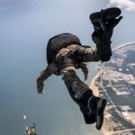 Picture of the Day: US Navy Explosive Ordnance Disposal Technicians Jump From a CH-47 Chinook helicopter