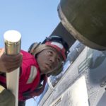 Picture of the Day: Marine Corps Cpl. Austin McClure Loads a Rocket on H-1W Cobra