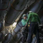 Picture of the Day: Aviation Electronics Mate 3rd Class Megan Calderon and Aviation Electronics Mate 2nd Class Andrew Cacacho Work on an MH-60R Sea Hawk