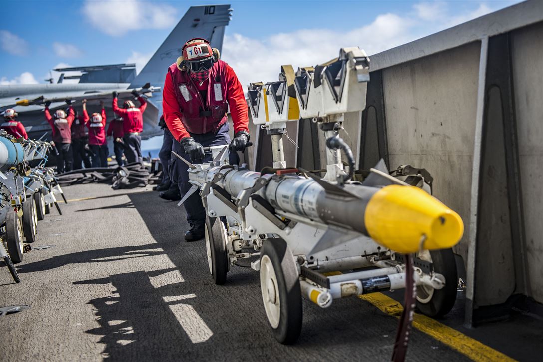 Picture of the Day: Seaman Charles Joseph Positions a Missile on the ...