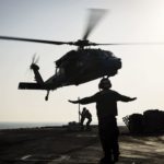 Picture of the Day: Sailors Attach Cargo to an MH-60S Seahawk Helicopter