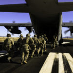 Picture of the Day: Rescue Personnel Load onto an HC-130J Combat King II